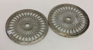A pair of silver and glass wine / bottle coasters.