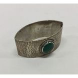 LIBERTY & CO: An enamelled silver napkin ring. Bir