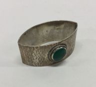 LIBERTY & CO: An enamelled silver napkin ring. Bir