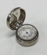 A rare and unusual cased silver barometer. London 1914. By