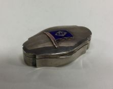 An Edwardian silver box with hinged lid and enamel