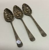 A group of three Georgian silver berry spoons. Lon