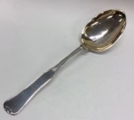A large Continental silver basting spoon with gilt