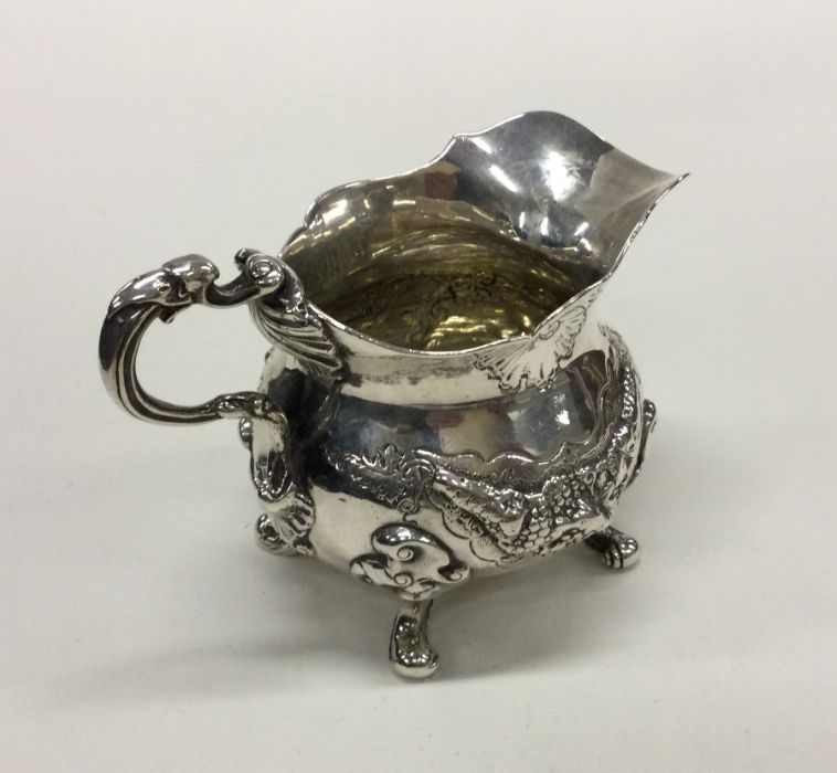 A cast Victorian silver cream jug in George II sty