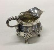 A cast Victorian silver cream jug in George II sty