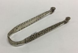 A fine pair of pierced silver sugar / ice tongs. L