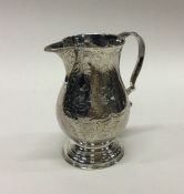 An early George II silver sparrow beak cream jug w