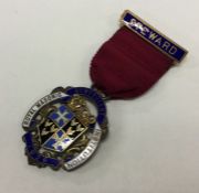 A silver and enamelled medal. Birmingham 1931. By