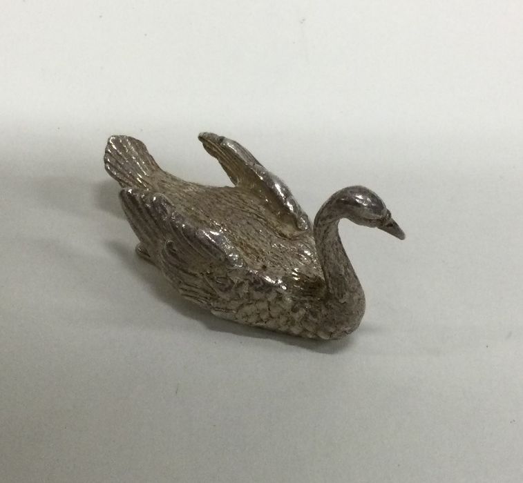A heavy cast figure of a swan with textured body. - Image 2 of 2