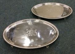 A good pair of George III oval silver salvers with