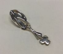 An unusual modernist silver caddy spoon with leaf