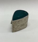 A chased Sterling silver hinged box with stone to