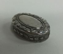 A chased silver hinged box. Approx. 7 grams. Est.