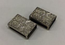 A pair of chased silver match cases. Approx. 41 gr