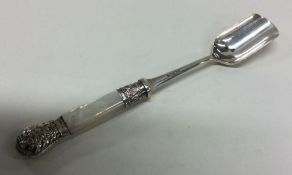 A rare silver and MOP cheese scoop. Sheffield. App