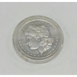 A silver 1oz American dollar. Approx. 30 grams. Es