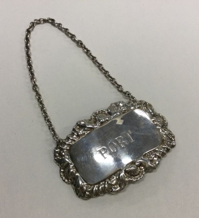 An Edwardian silver wine label for 'Port' on suspe