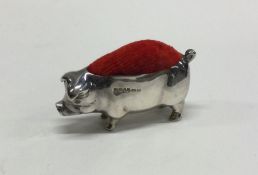 A silver pin cushion in the form of a pig. Approx.