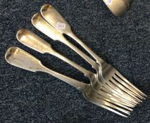 A heavy set of five silver fiddle pattern table fo