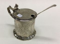 A Victorian silver florally engraved mustard pot L
