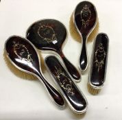 A silver and tortoiseshell brush and mirror set. E
