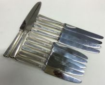 A set of six (plus six) table and dessert cast knives.