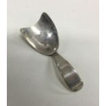 An unusual shaped silver caddy spoon. London 1808.