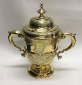 A large rare George II chased silver gilt trophy c
