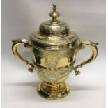 A large rare George II chased silver gilt trophy c