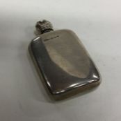 An Edwardian silver scent bottle of shaped form. B