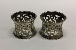 A pair of pierced silver napkin rings with beadwor
