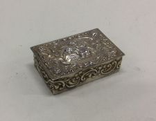 A chased silver box. Approx. 30 grams. Est. £60 -