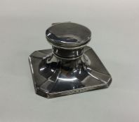 An Edwardian silver capstan inkwell of square form