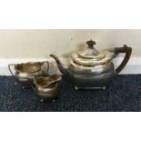 A heavy silver three piece tea service. London. Ap