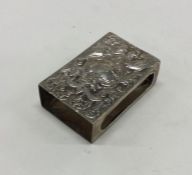 A Victorian chased silver match case. London 1889.