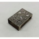 A Victorian chased silver match case. London 1889.