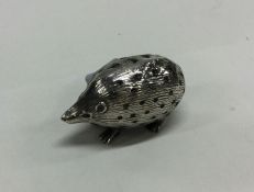 A silver pin cushion in the form of a hedgehog. Bi