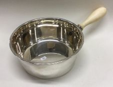 A large Dutch silver saucepan of tapering form wit