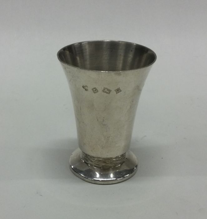 A heavy tapering silver vase of textured form. Bir