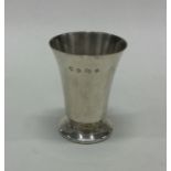 A heavy tapering silver vase of textured form. Bir