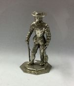 A heavy cast Continental silver figure of a man in