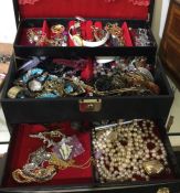 A box containing costume jewellery. Est. £20 - £30