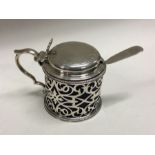 A fine quality pierced Victorian silver mustard pot. London 1878. By Jackson and Chase. Approx.