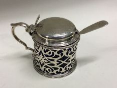 A fine quality pierced Victorian silver mustard pot. London 1878. By Jackson and Chase. Approx.