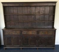 A massive oak three drawer kitchen dresser. Est. £