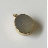 A good antique oval pendant inset with hard stone.