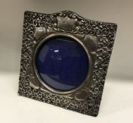 A chased silver frame with bird decoration. London 1986. By Keyford Frames Ltd. Approx. grams.