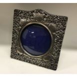 A chased silver frame with bird decoration. London 1986. By Keyford Frames Ltd. Approx. grams.