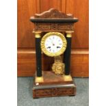 A French mantle clock with inlaid decoration. Est.