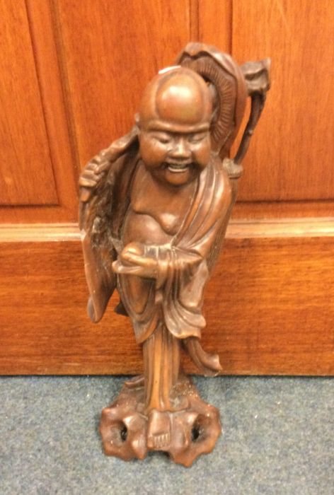 An Oriental root wood figure of a man. Approx. 38